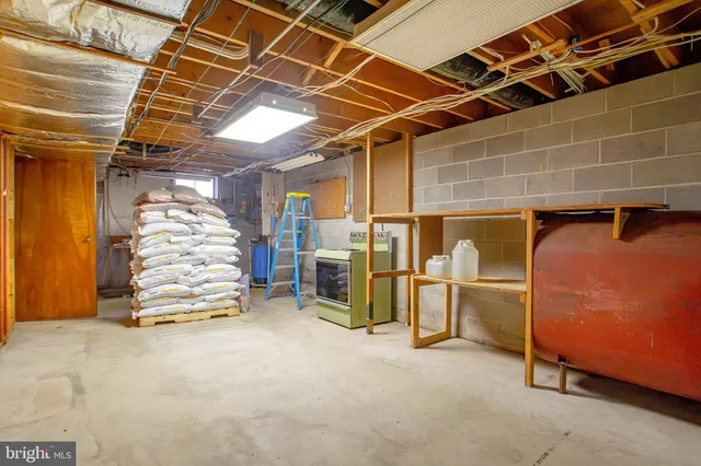 a room with wooden furniture and a kitchen