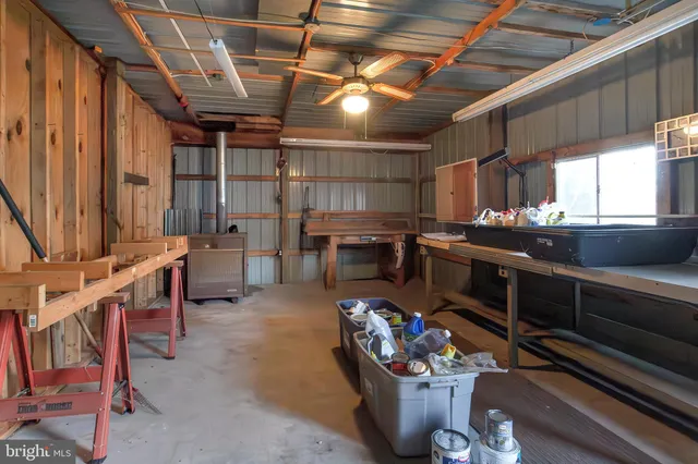 a reading room with furniture and a book shelf