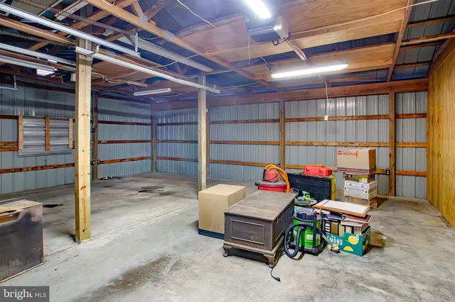 a view of an empty room with wooden walls