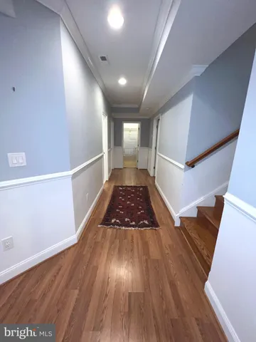 a view of entryway with wooden floor