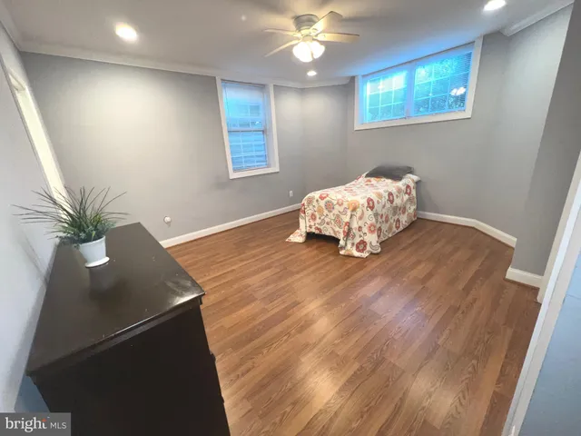a room with wooden floor and window