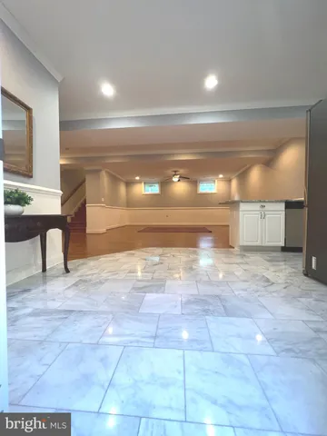 a view of a hallway with two windows