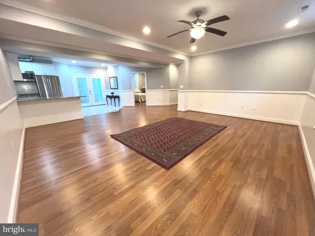 a view of a living room and wooden floor