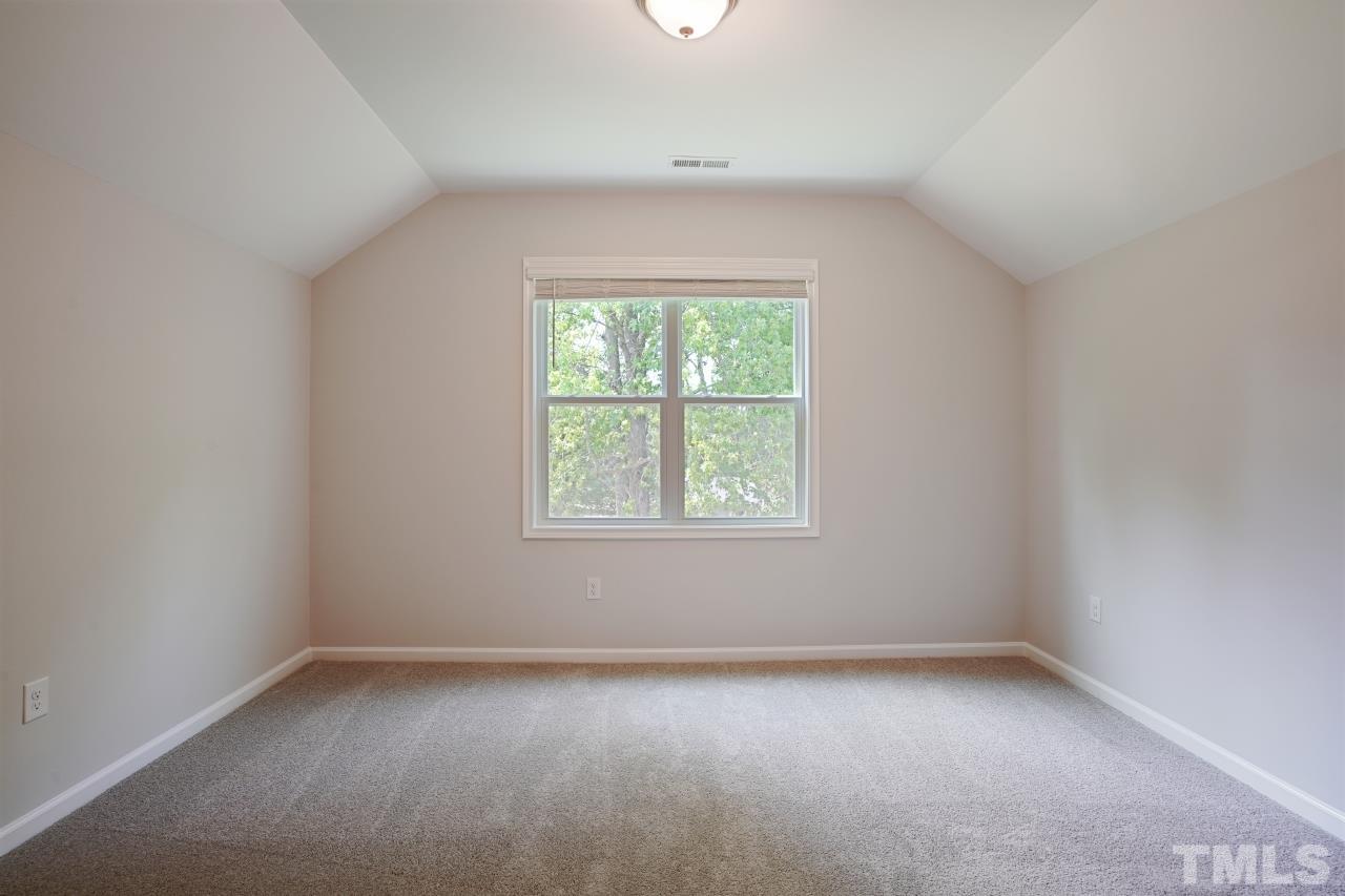 393 Madden Rose Loop Garner, NC 27529 - Photo 27 of 31 an empty room with a window