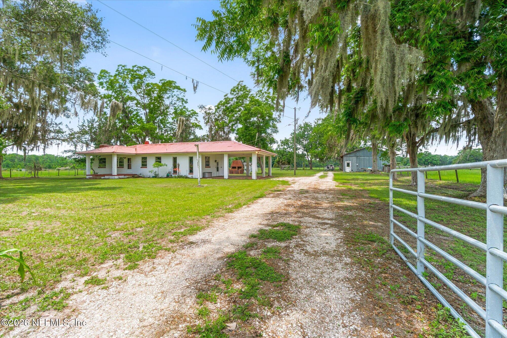 786 West River Road Palatka, FL 32177 - Photo 29 of 53 a view of a house with a yard