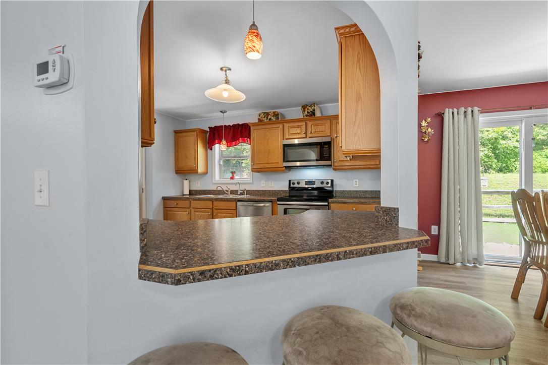 7353 Farrier Road Orefield, PA 18069 - Photo 26 of 74 An arched pass-through connects the kitchen to the adjacent dining space.