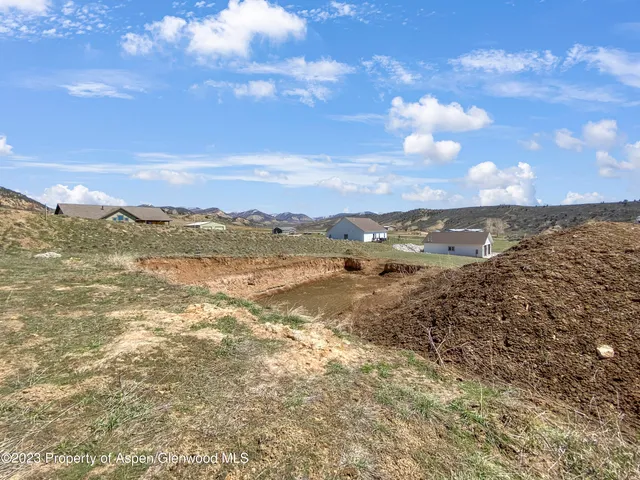 a view of an ocean with a mountain
