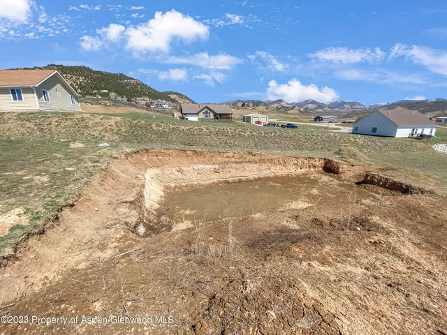 a view of an ocean and a mountain