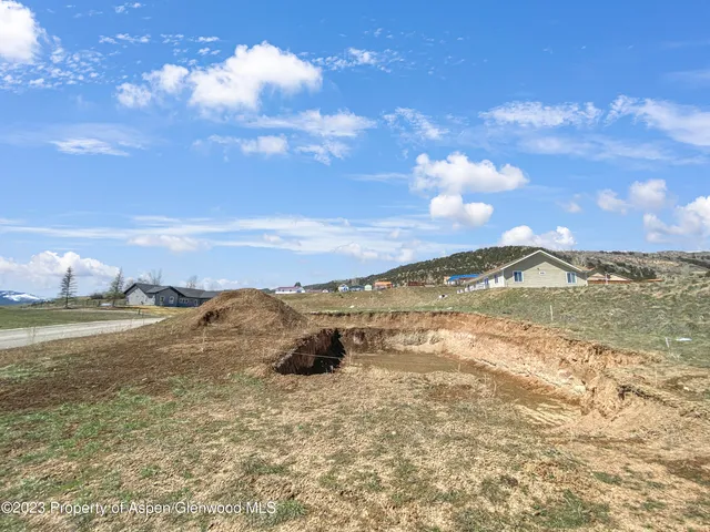 a view of a lake with a yard
