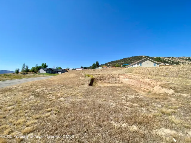 a view of a large body of water with a building in the background