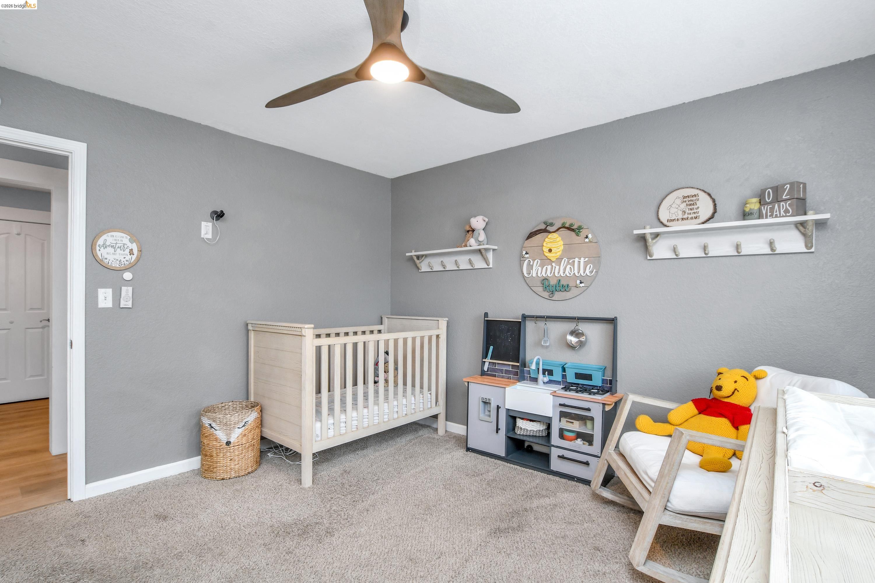 1432 Willow Lake Road Discovery Bay, CA 94505 - Photo 19 of 40 Carpeted room featuring a modern ceiling fan with integrated lighting, neutral wall paint, and white trim