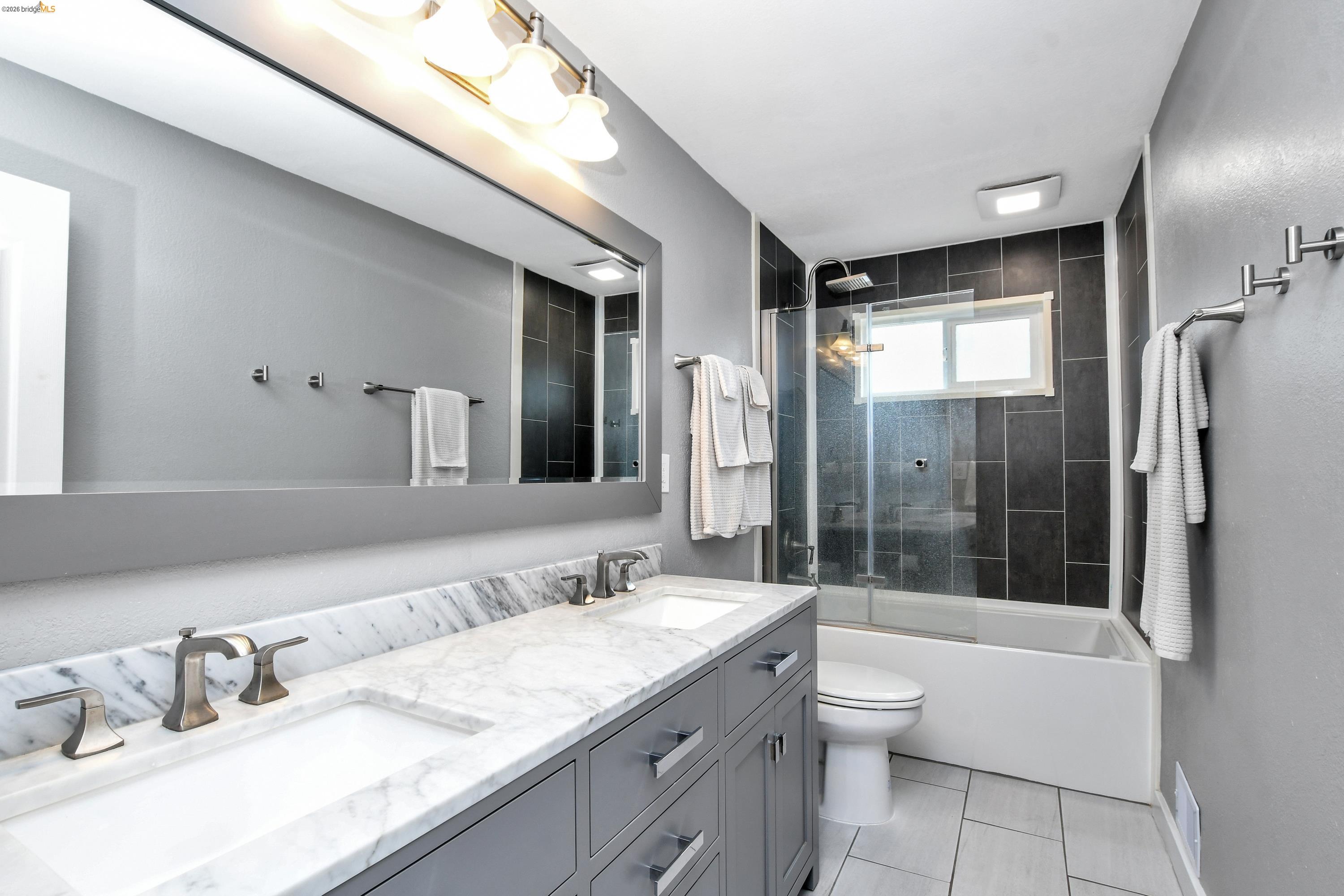 1432 Willow Lake Road Discovery Bay, CA 94505 - Photo 22 of 40 Dual vanity with a stone countertop and undermount sinks