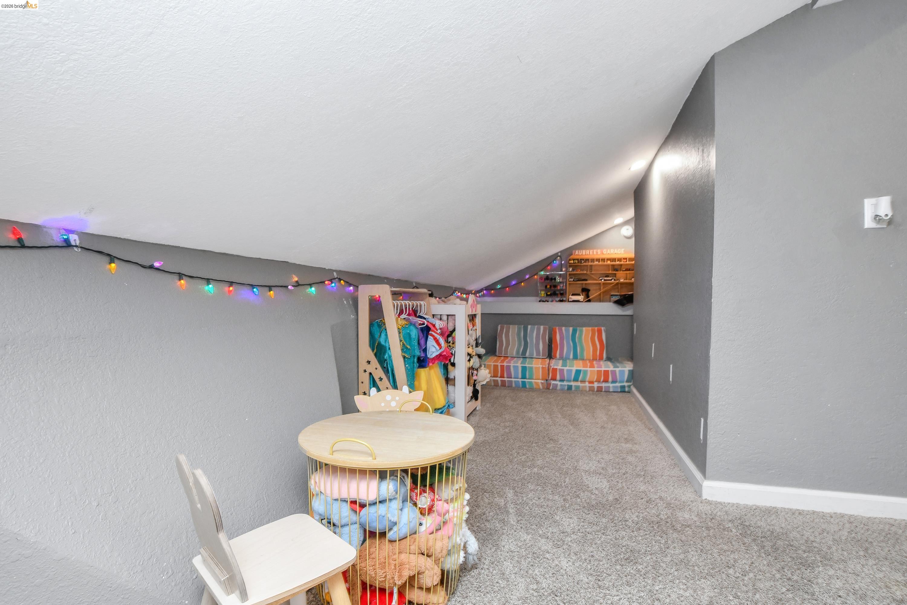 1432 Willow Lake Road Discovery Bay, CA 94505 - Photo 24 of 40 Carpeted attic space with sloped ceilings and gray walls