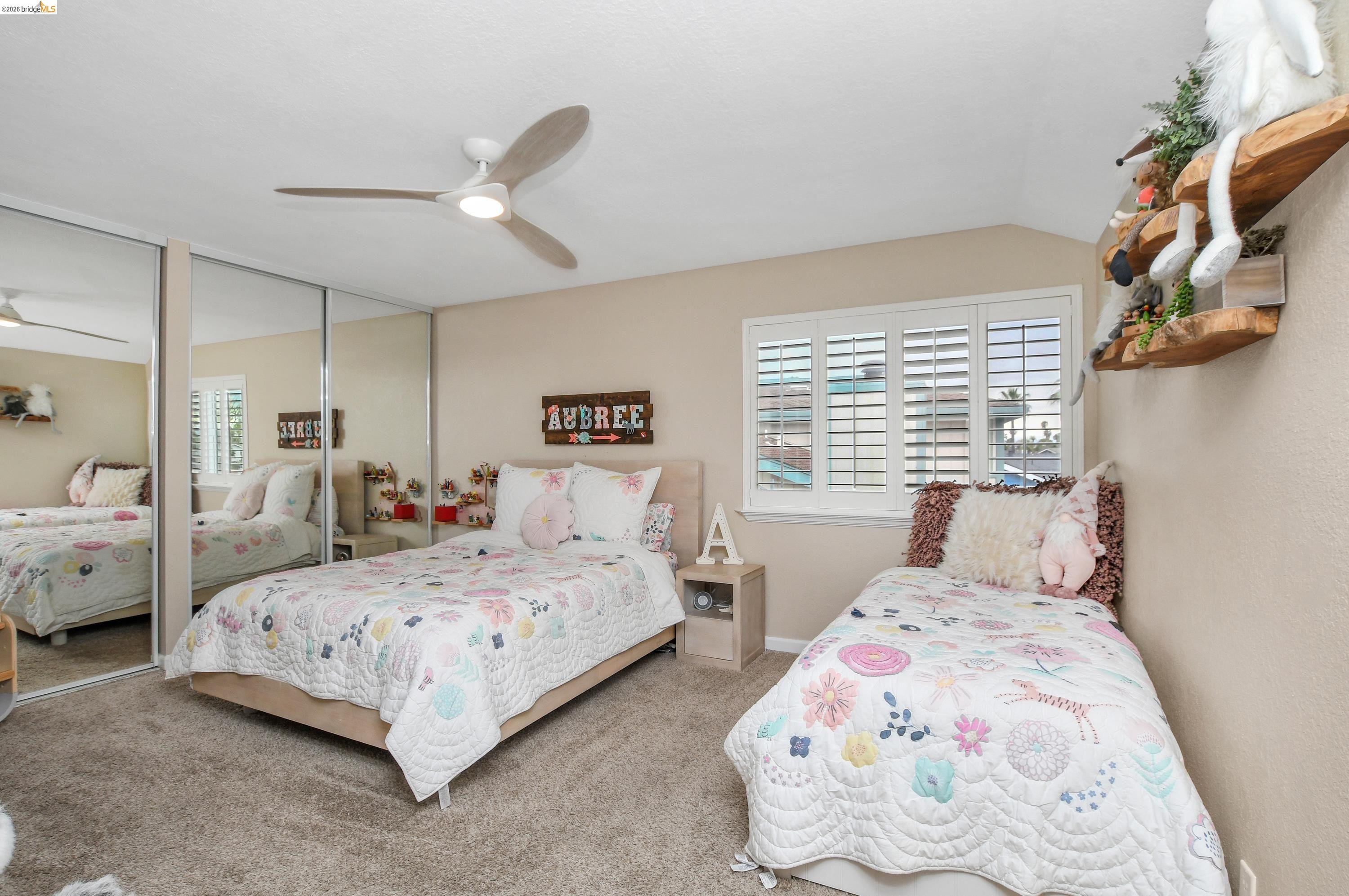 1432 Willow Lake Road Discovery Bay, CA 94505 - Photo 25 of 40 Plush carpeting throughout, white plantation shutters, a contemporary ceiling fan, and mirrored closet doors