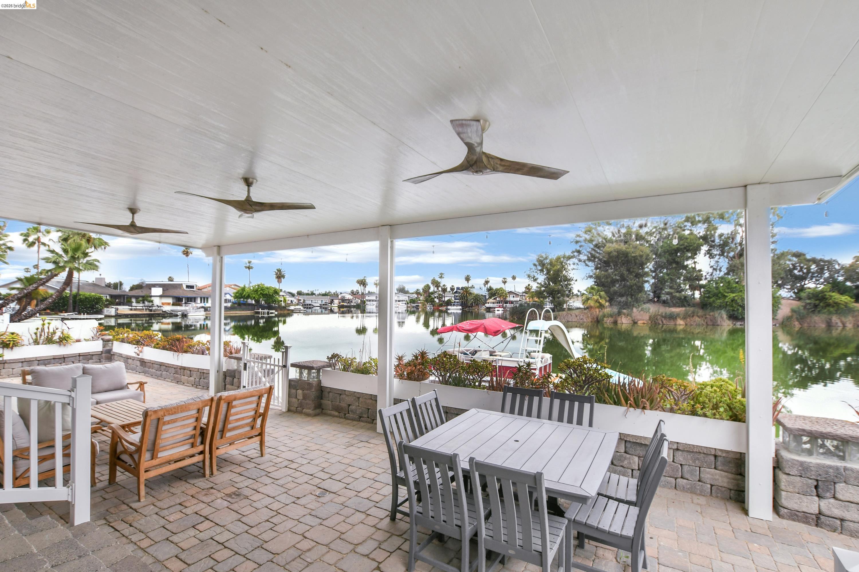 1432 Willow Lake Road Discovery Bay, CA 94505 - Photo 31 of 40 Covered outdoor patio with a paver floor and multiple ceiling fans