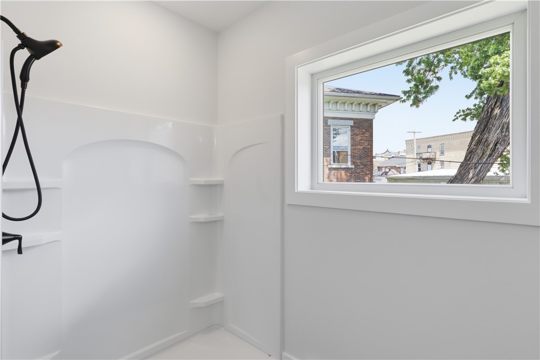 107 Water Street, Unit 107 Milo, NY 14527 - Photo 23 of 47 Primary Bedroom Low Step Shower