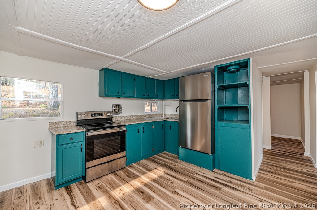 161 White Oak Street Carthage, NC 28327 - Photo 13 of 29 a kitchen with stainless steel appliances granite countertop a refrigerator and a sink