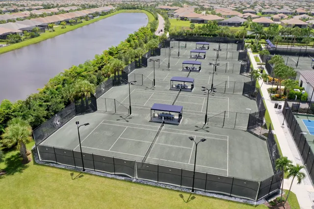 an aerial view of a house with a lake view