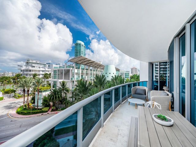 a view of balcony with furniture