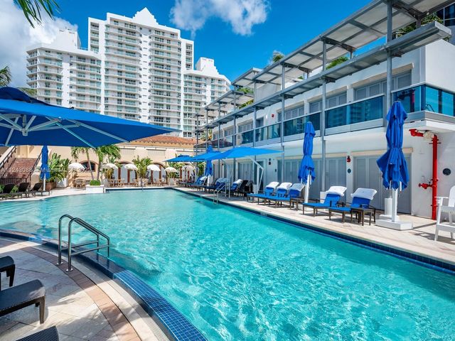 a view of a chairs and table in the patio