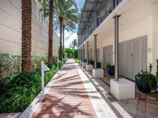 a view of a patio with couches and potted plants