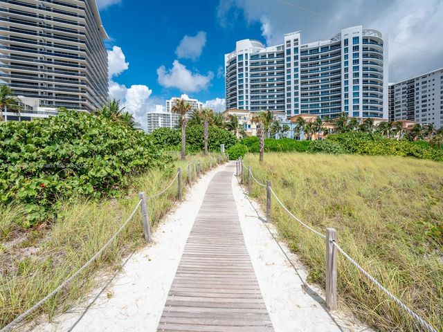 a view of a pathway both side of house