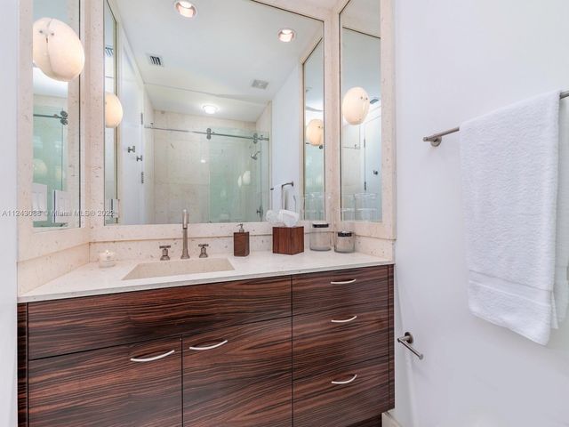 a bathroom with a sink double vanity and a mirror