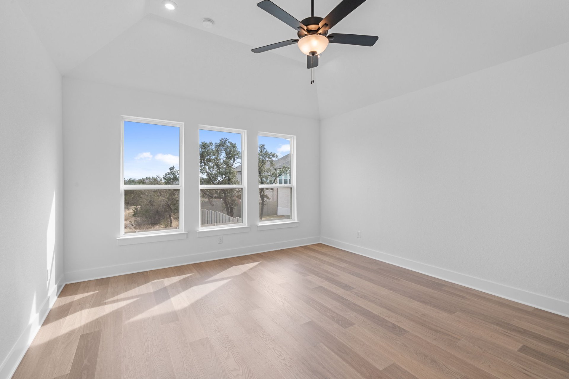 408 Texas Drive Georgetown, TX 78628 - Photo 18 of 39 a view of an empty room with a window and wooden floor