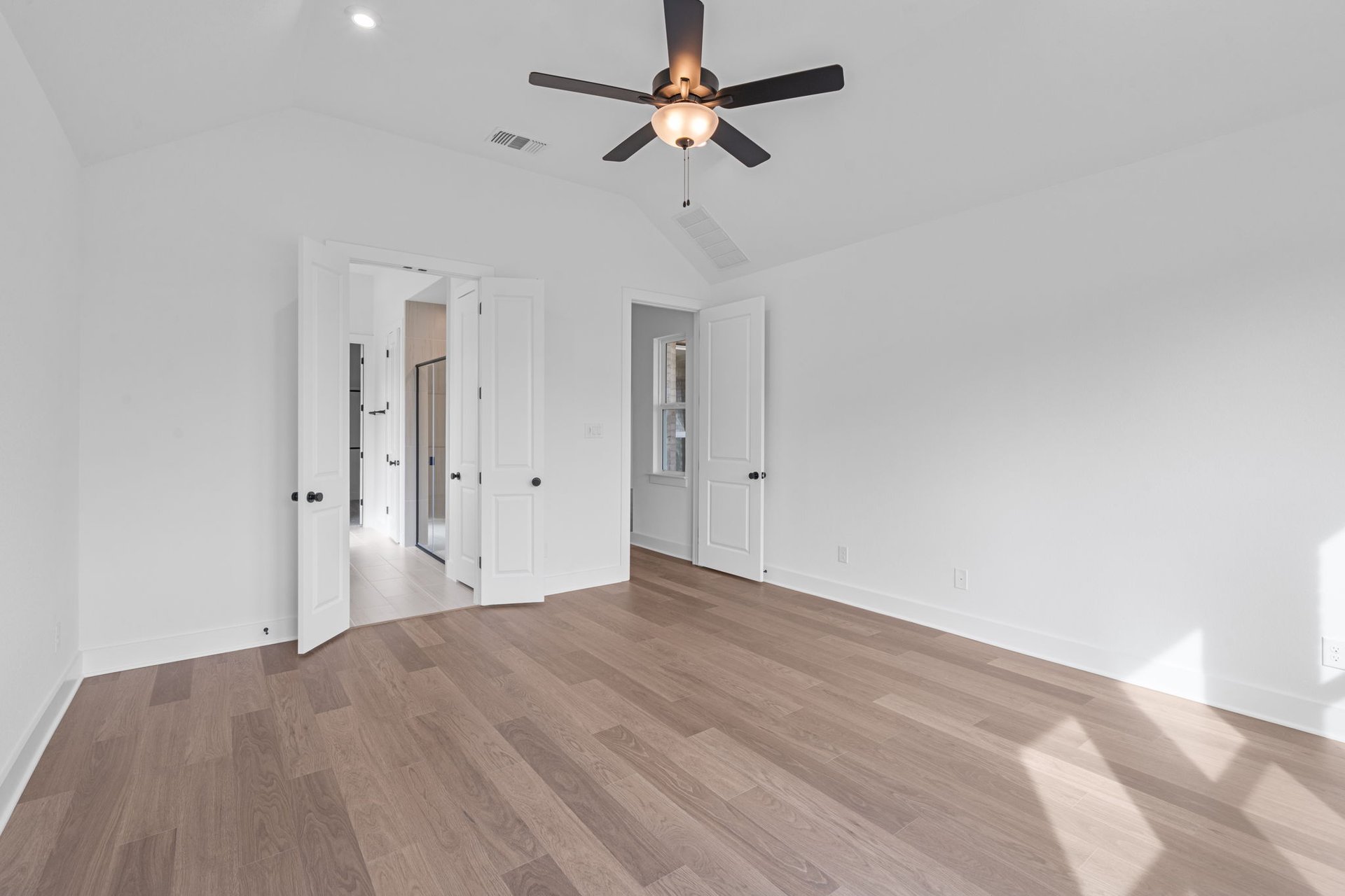 408 Texas Drive Georgetown, TX 78628 - Photo 19 of 39 a view of a room with a ceiling fan and a hardwood floor