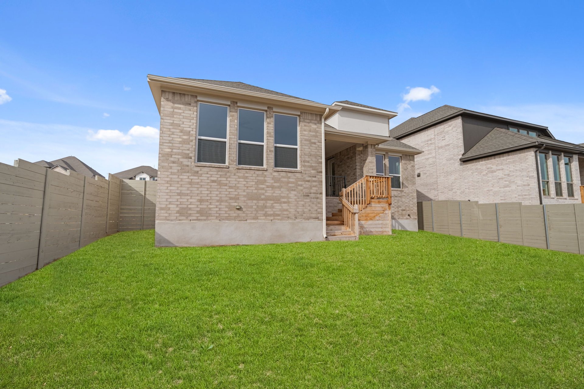 408 Texas Drive Georgetown, TX 78628 - Photo 31 of 39 a front view of a house with a yard and garage