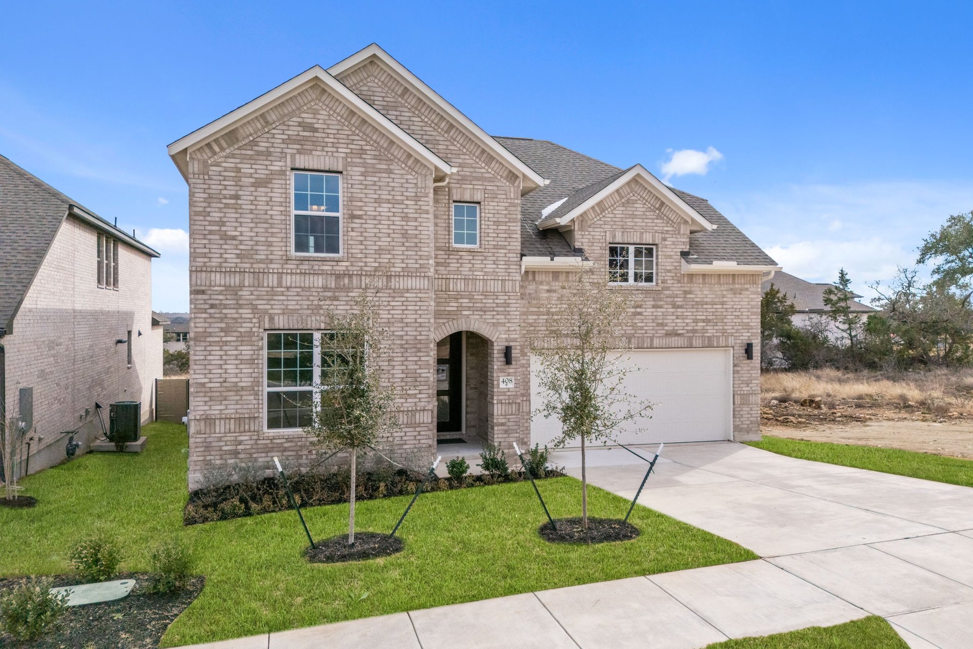 408 Texas Drive Georgetown, TX 78628 - Photo 4 of 39 a front view of a house with a yard