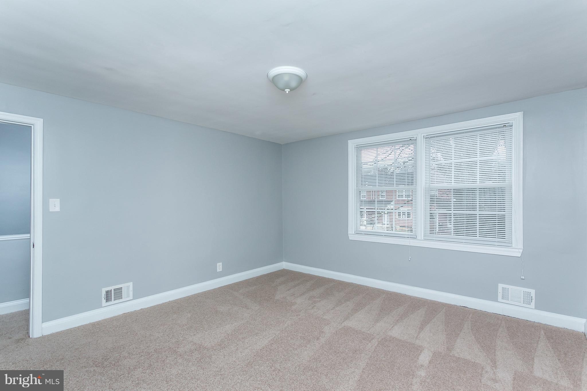 1033 Reverdy Road Baltimore, MD 21212 - Photo 14 of 29 an empty room with a window