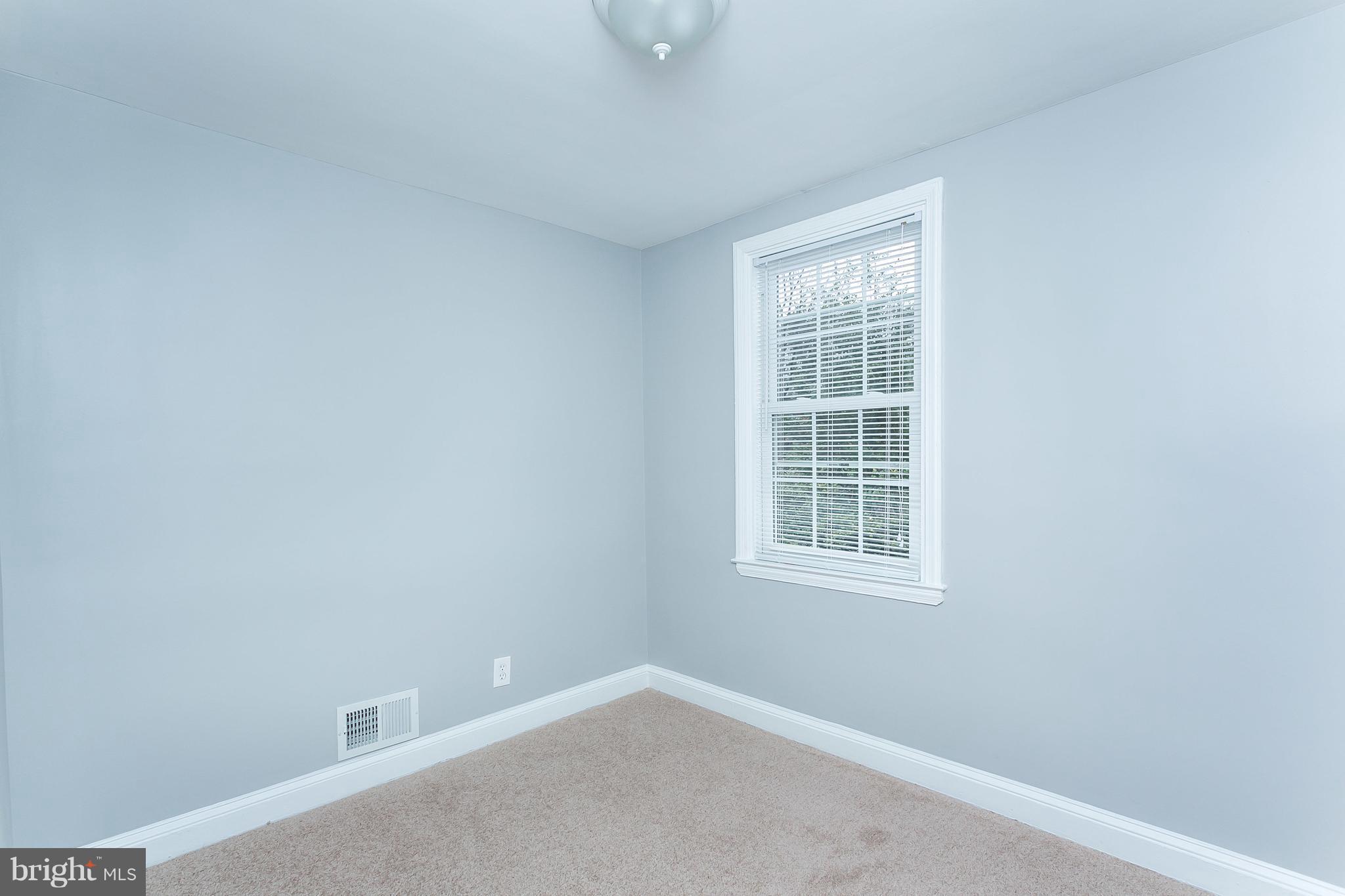 1033 Reverdy Road Baltimore, MD 21212 - Photo 17 of 29 a view of an empty room with a window