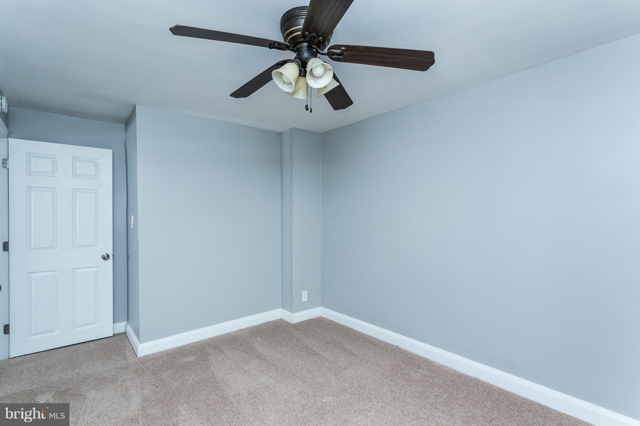 1033 Reverdy Road Baltimore, MD 21212 - Photo 20 of 29 an empty room with a ceiling fan and fan