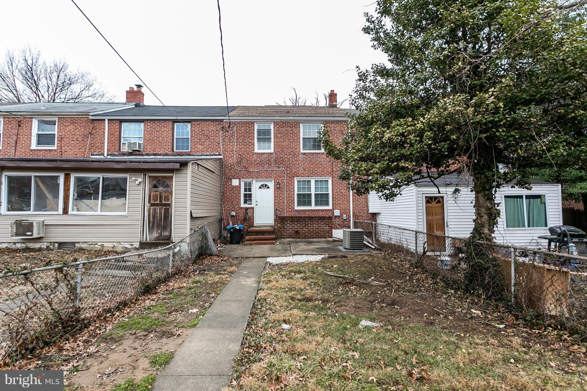 1033 Reverdy Road Baltimore, MD 21212 - Photo 29 of 29 a front view of a house with yard