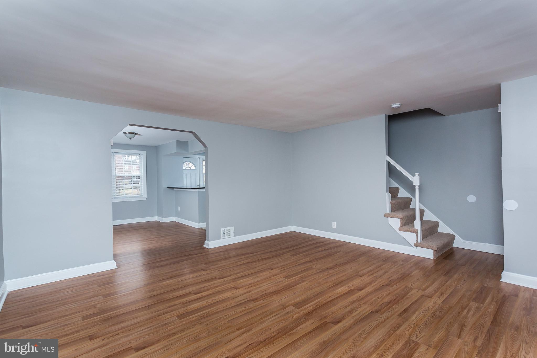 1033 Reverdy Road Baltimore, MD 21212 - Photo 6 of 29 a view of empty room with wooden floor