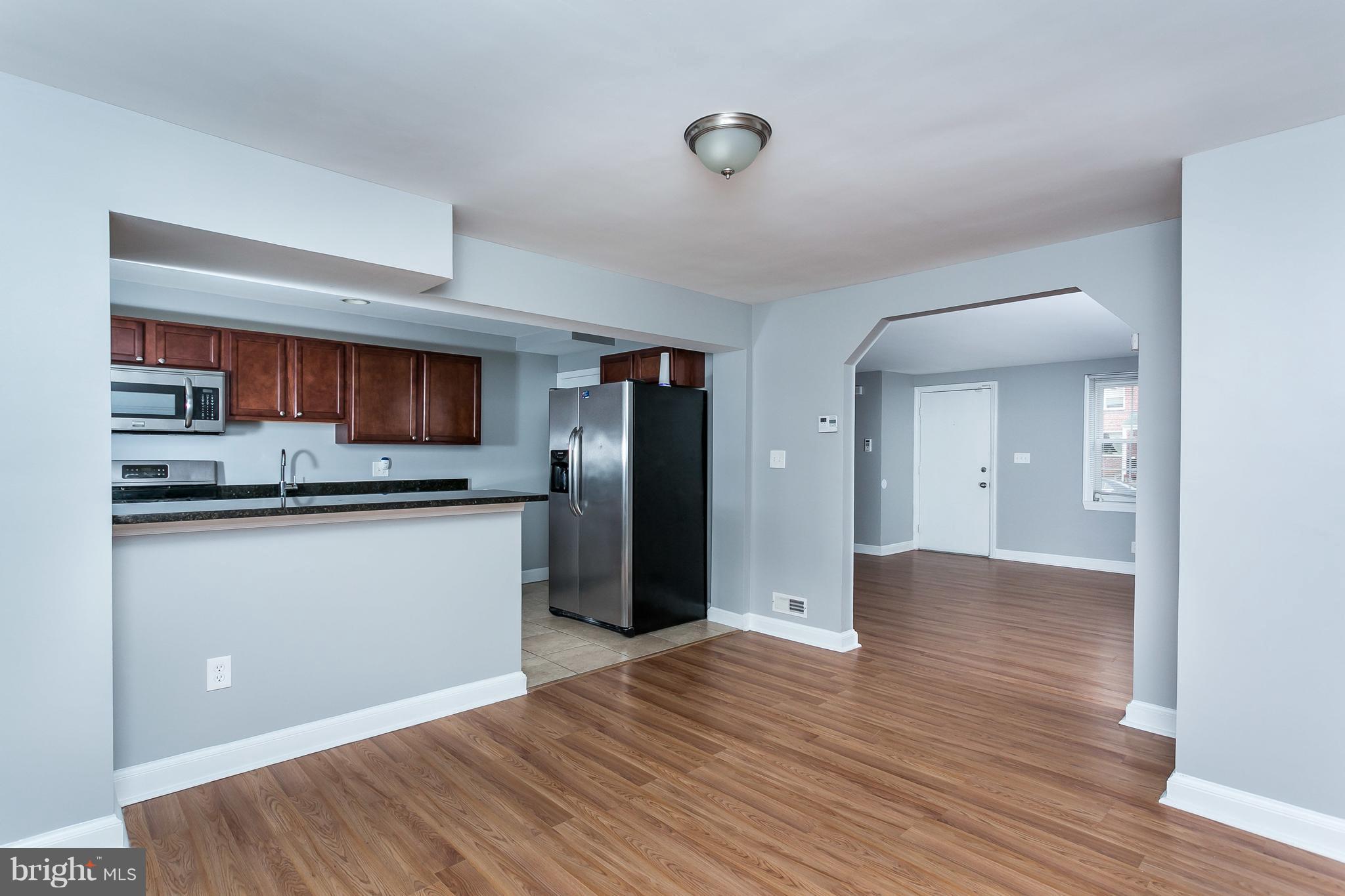 1033 Reverdy Road Baltimore, MD 21212 - Photo 9 of 29 a view of a kitchen cabinets and wooden floor