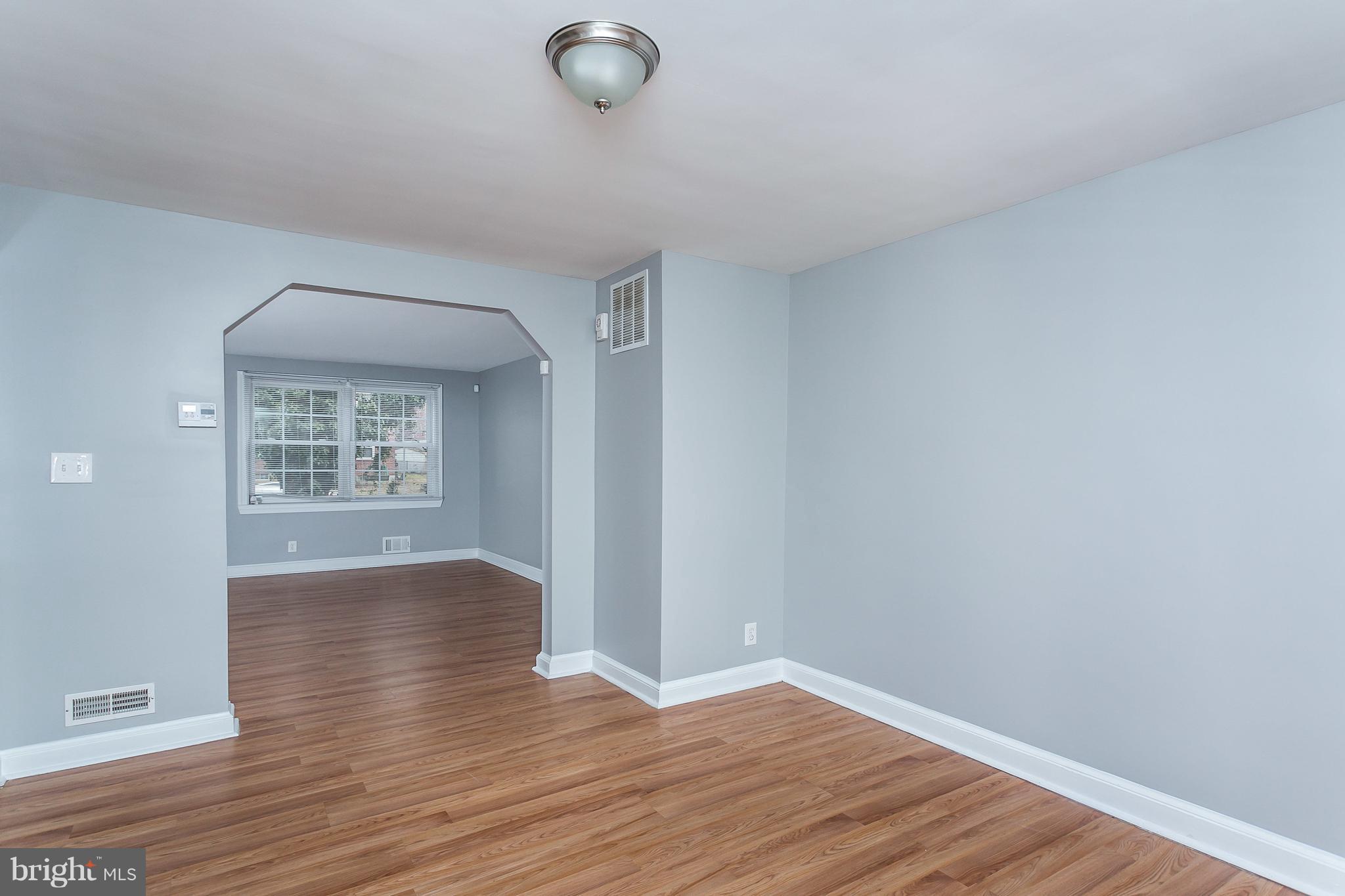 1033 Reverdy Road Baltimore, MD 21212 - Photo 10 of 29 a view of livingroom with hardwood floor and window