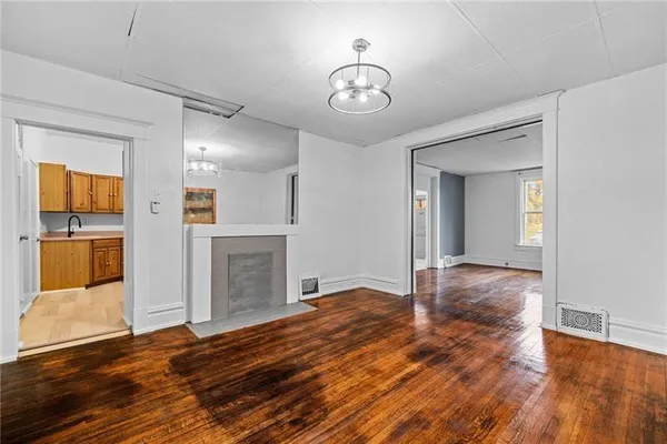 a view of a livingroom with wooden floor