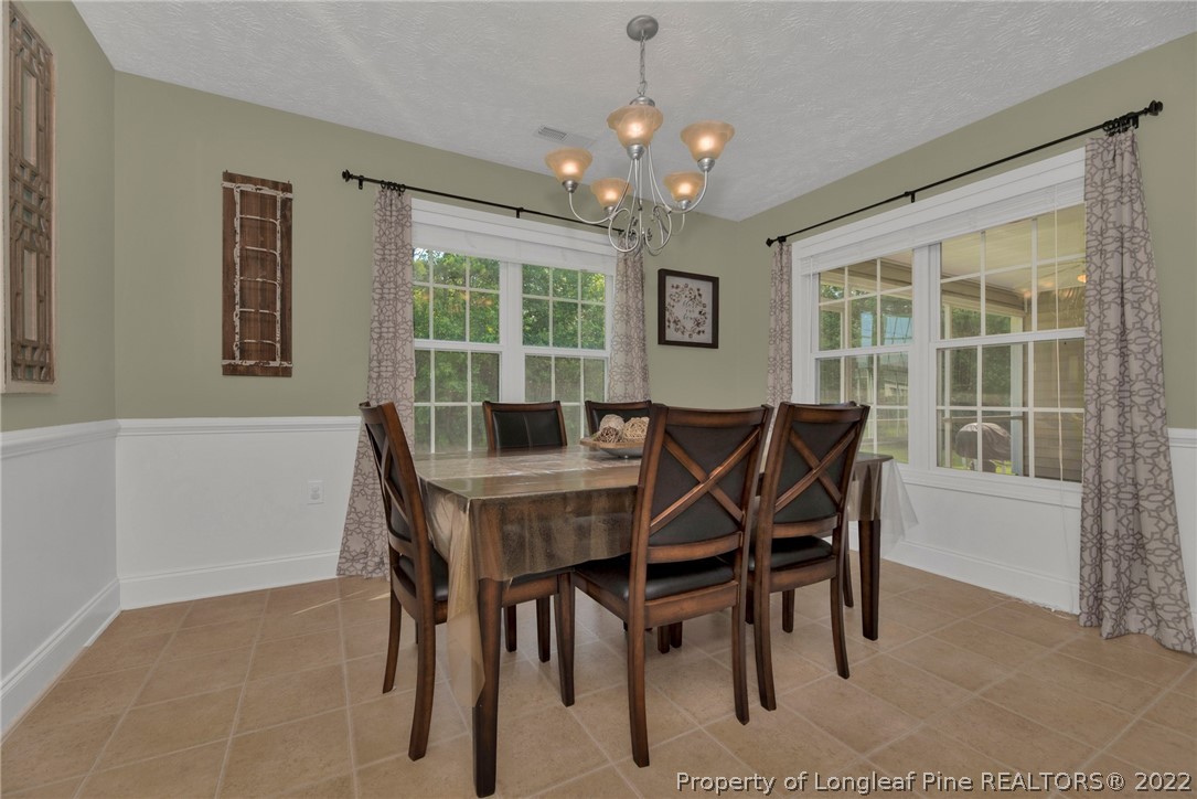 723 Cape Fear Road Raeford, NC 28376 - Photo 13 of 33 a view of a dining room with furniture window and outside view