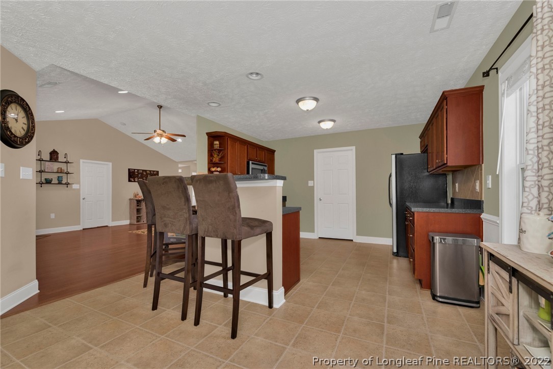 723 Cape Fear Road Raeford, NC 28376 - Photo 14 of 33 a view of kitchen with furniture and wooden floor