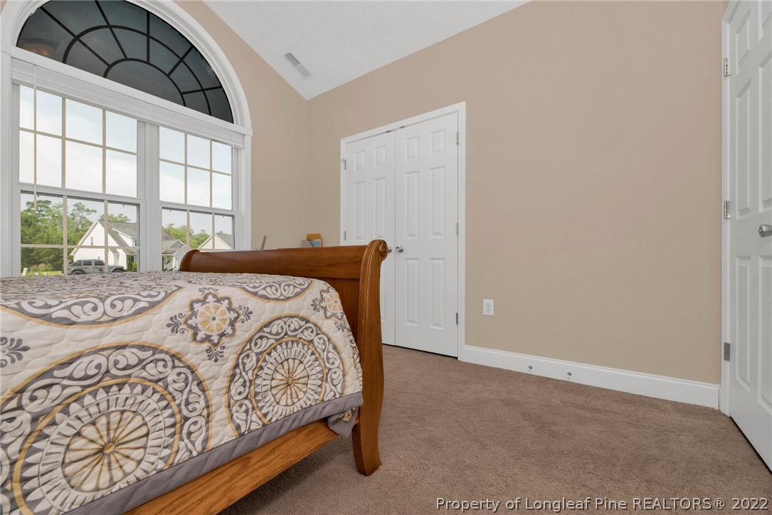 723 Cape Fear Road Raeford, NC 28376 - Photo 21 of 33 a bedroom with a bed and a large window