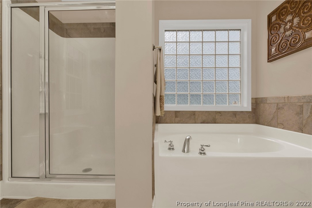 723 Cape Fear Road Raeford, NC 28376 - Photo 28 of 33 a bathroom with a bathtub and shower