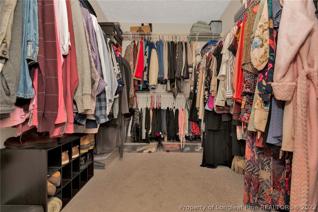 723 Cape Fear Road Raeford, NC 28376 - Photo 29 of 33 a view of walk in closet with clothes