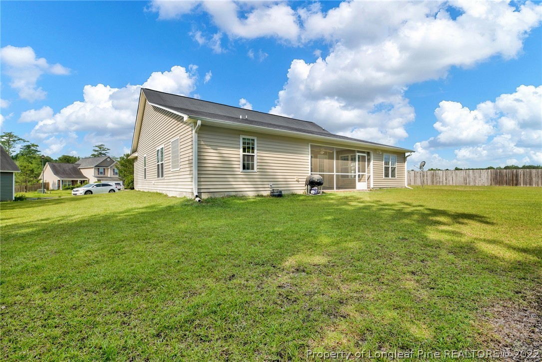723 Cape Fear Road Raeford, NC 28376 - Photo 30 of 33 a view of a house with a yard