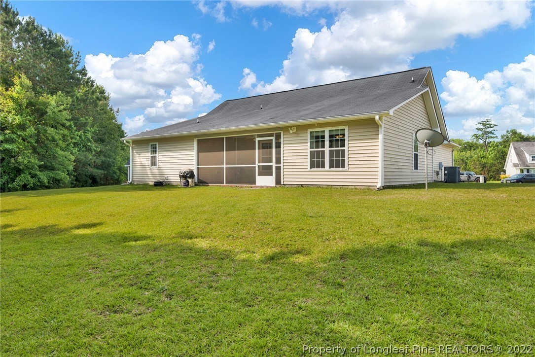 723 Cape Fear Road Raeford, NC 28376 - Photo 32 of 33 a view of a house with yard and sitting area