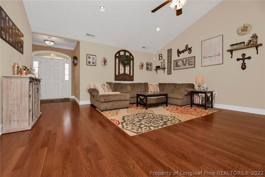 723 Cape Fear Road Raeford, NC 28376 - Photo 7 of 33 a living room with furniture and wooden floor