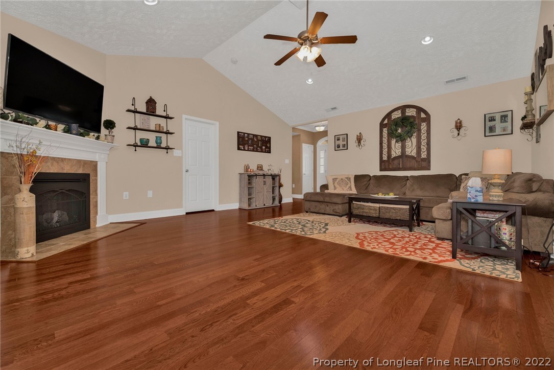 723 Cape Fear Road Raeford, NC 28376 - Photo 8 of 33 a living room with furniture and a flat screen tv