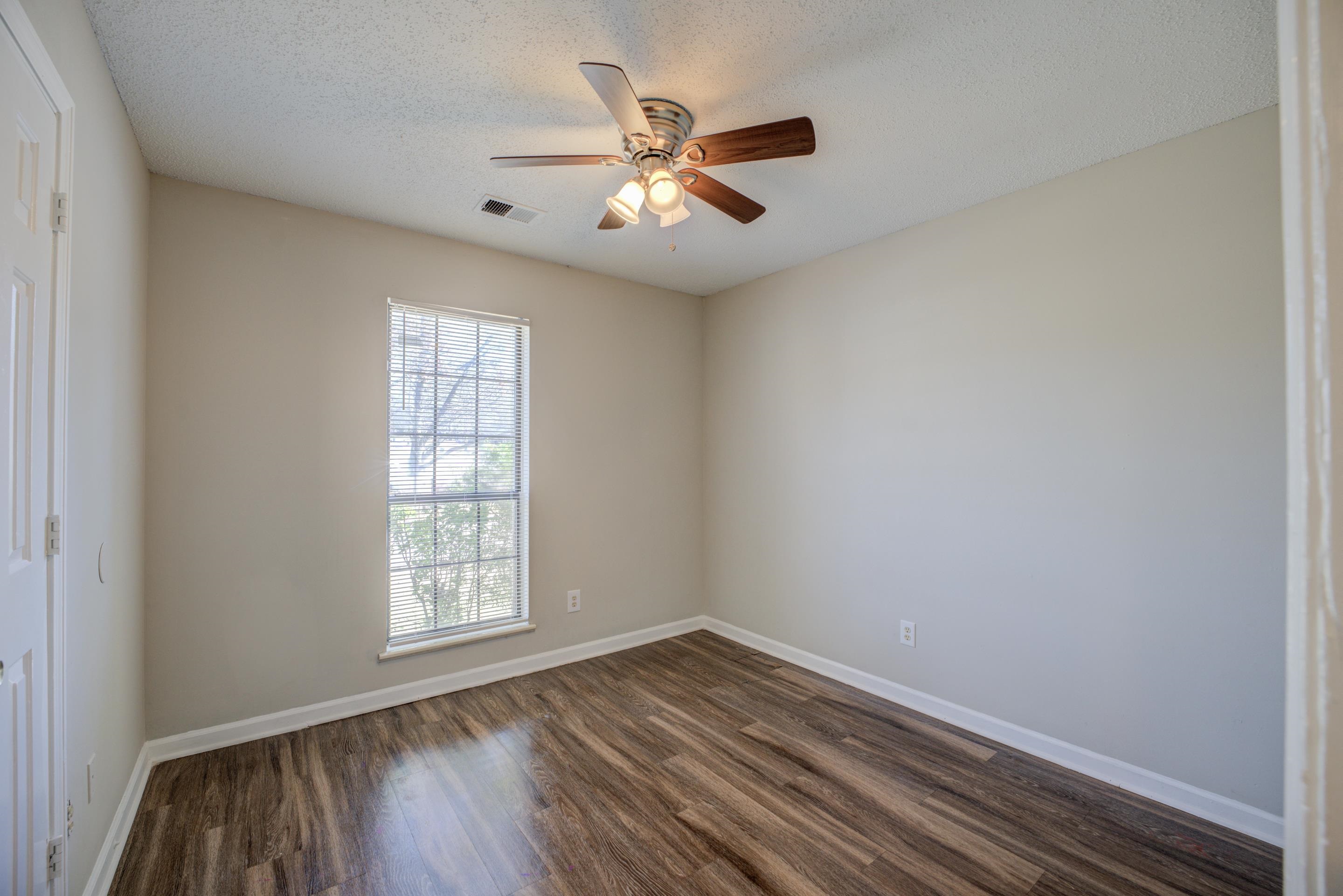 3501 Chowning Road Memphis, TN 38135 - Photo 16 of 25 Spare room featuring dark hardwood / wood-style flooring, ceiling fan, and a textured ceiling