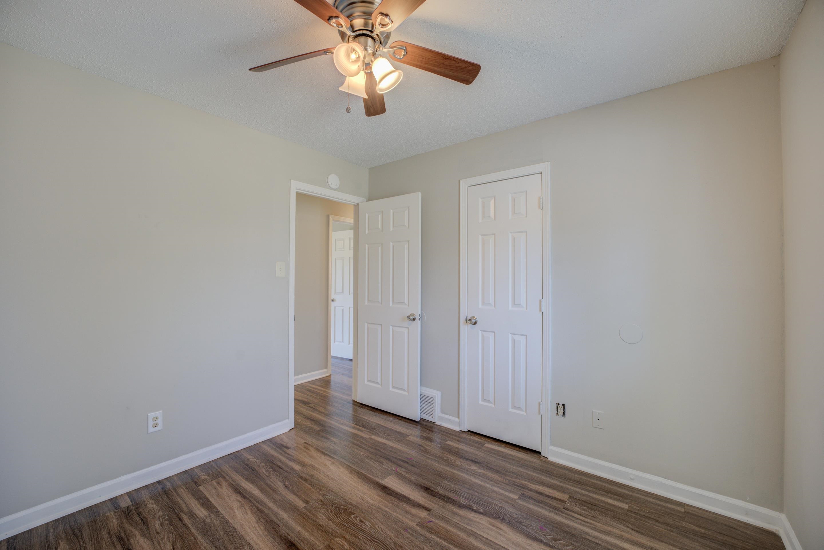 3501 Chowning Road Memphis, TN 38135 - Photo 17 of 25 Unfurnished bedroom featuring dark hardwood / wood-style flooring and ceiling fan